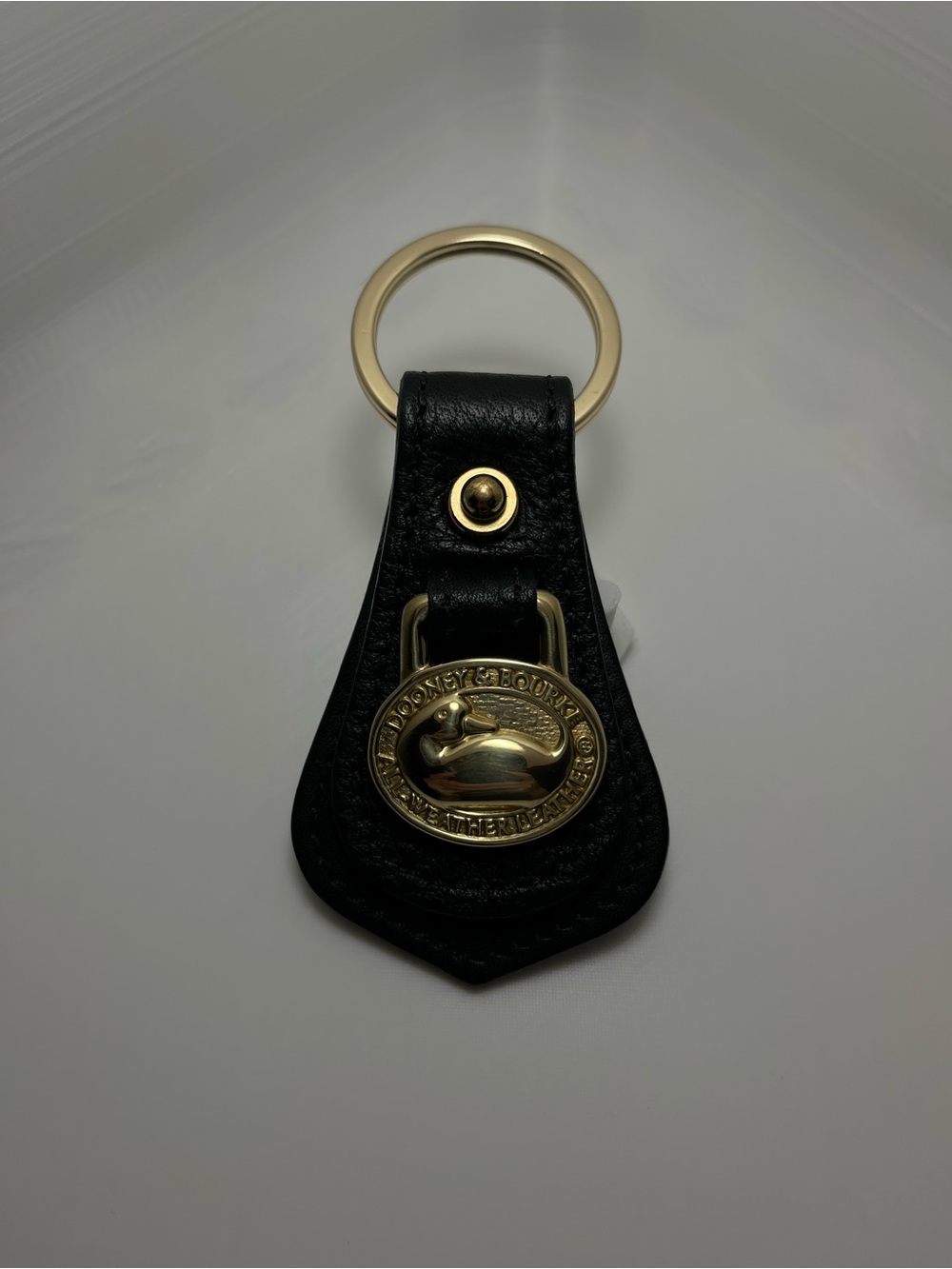 Dooney & Bourke Black Leather Key Chain with Gold Medallion